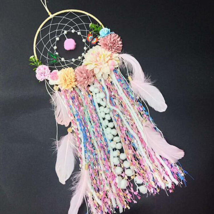 Floral dream catcher with pom poms and feathers - kids wall decor