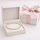 Newborn pearl and gold bracelet