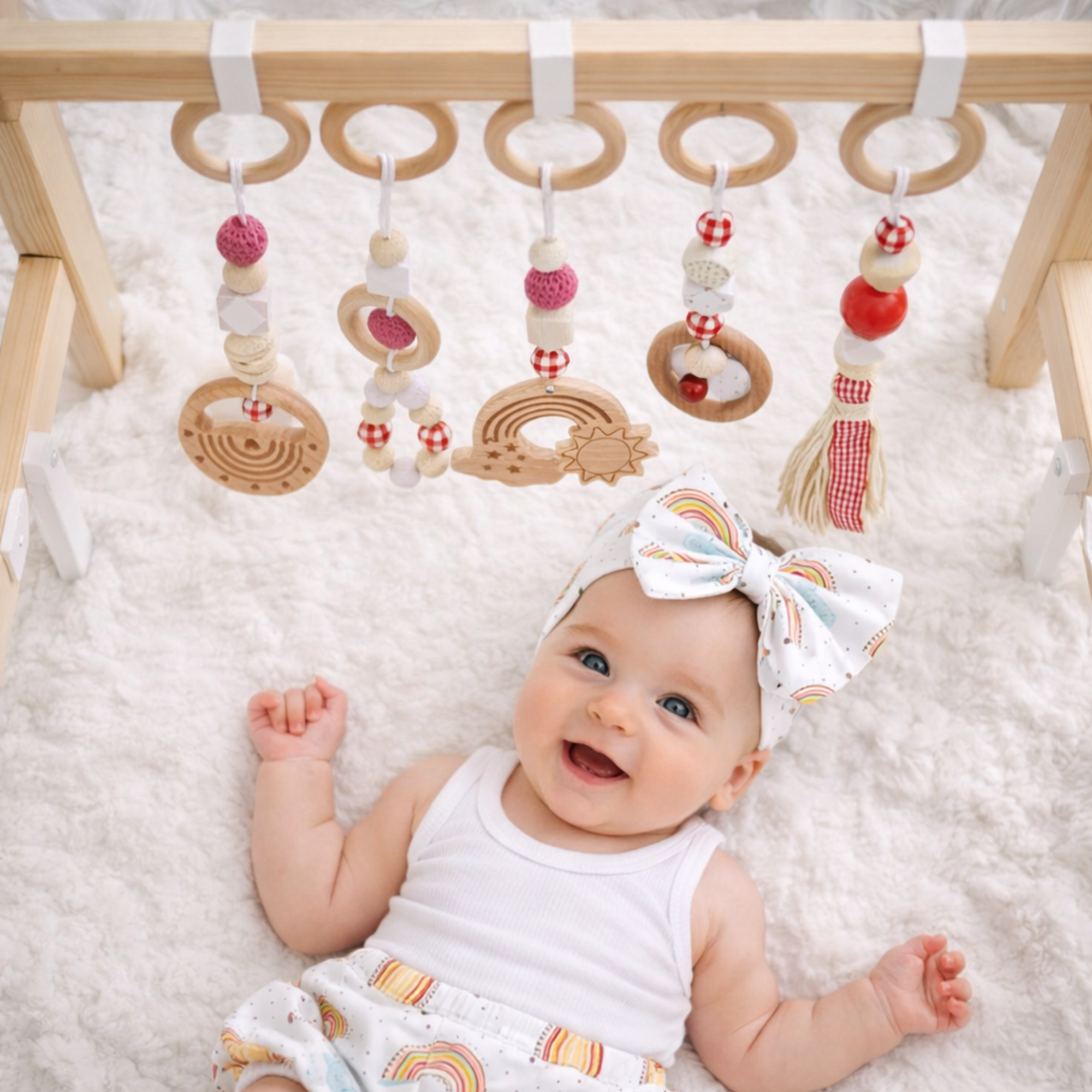 wooden hanging baby toy set made from natural beech wood with high-contrast shapes, BPA-free and eco-friendly, suitable for pram, activity gym or nursery, presented in gift box.